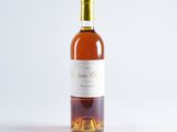 a bottle of wine that is sitting on a table