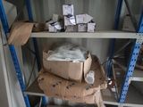a shelf with boxes and boxes on it in a room
