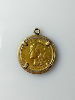 a close up of a coin on a white surface