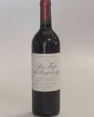 a bottle of wine that is sitting on a table