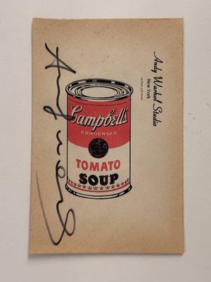 a close up of a piece of paper with a can of soup on it