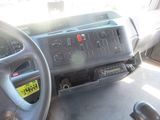 a dashboard of a truck with a yellow sticker on it