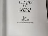 an open book with a black and white image of a cat