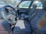 a picture of the interior of a car with a steering wheel
