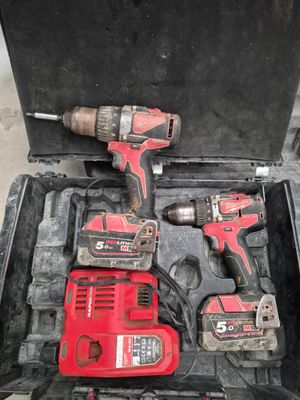 two tools in the case that are sitting on the floor