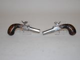 pair of silver and tortoise mounted pistols on lucine bases