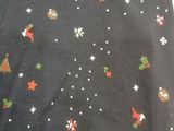 christmas trees and snowflakes on a black t - shirt with red and green stars