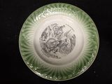 a plate with a drawing on it on a black table