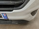 a close up of a car ' s front grill with the number plate of a honda