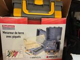 a box of tools sitting on a table in a room