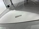 a sticker on the hood of a car that is parked in a garage