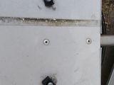 two pieces of metal on the side of a building
