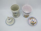 three cups and a saucer sitting on a table