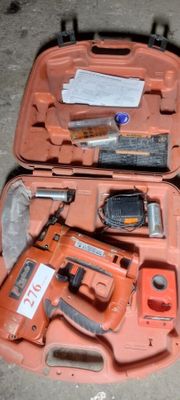 an orange tool case with tools in it on the floor