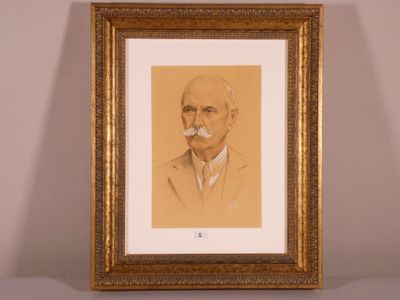 an old picture of a man with a moustache in a gold frame