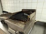 a grill that is sitting on a counter in a kitchen