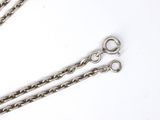 two silver chains are shown on a white surface