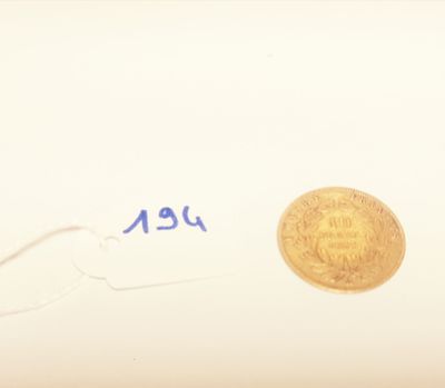an image of a gold coin sitting on top of a piece of paper