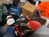 a pile of assorted items on a couch