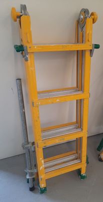 a yellow ladder leaning against a wall in a room