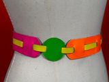 a mannequin torso with a colorful belt on it