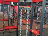 a gym with a lot of equipment in the room