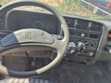 dashboard of a car with a steering wheel and dashboard controls