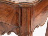 a small wooden table with a drawer underneath it
