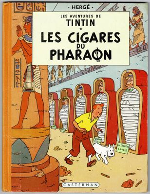 la couverture du livre *Les Cigars Pharon*, sur laquelle figure l'image d'un homme et d'un chien