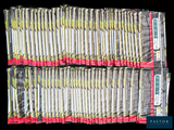 a lot of cigarettes wrapped in plastic bags on a black background