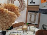 a table with a bunch of candles and a sign on it
