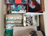 a box full of assorted items that are sitting on the floor