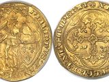 a gold coin with a woman holding a cross on it