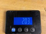 a digital clock that is on a table