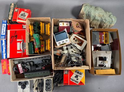 a box full of assorted toy trains and other items
