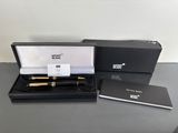 an image of a black box with a pen and a notepad in it