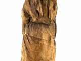 statue of a woman carrying a basket on her back