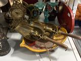 a lot of antique items on display in a glass case