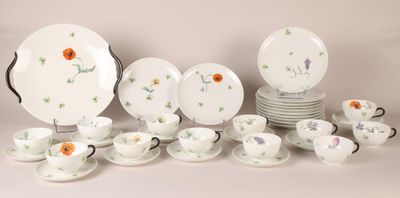 many plates and cups that are sitting on a table