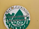 a green and white sign on the side of a building