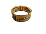 a close up of a gold bracelet with a logo on it