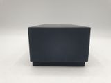 an empty black box sitting on top of a white surface
