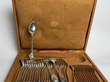 a wooden box with a set of silverware in it