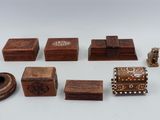several pieces of wood are arranged in a row on a white surface