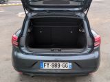 the back of a car with its trunk open in a parking lot