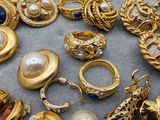 a lot of gold jewelry on the ground