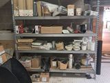 a room that has a lot of shelves and boxes on it