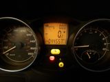 a dashboard with a speedometer, a clock, and a smiley face