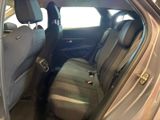the back seat of a car with the door open and the passenger seat down