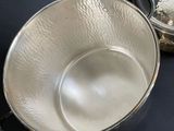 two pans that are sitting on a table